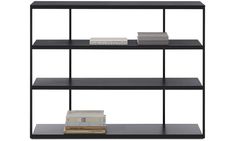 three black shelves with books on each shelf