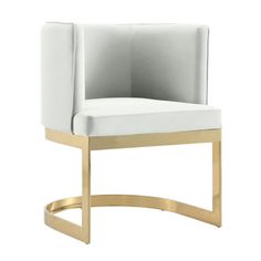 an upholstered chair with gold legs and a white fabric seat cover on the back