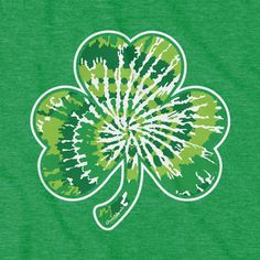 a green shirt with a four leaf clover on it