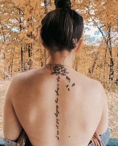 a woman with a tattoo on her back