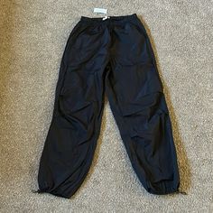 Bundle Any 2+ Items For 25% Off Black Parachute Pants, Very Baggy And Trendy, Runs Big Fits More Like A Size Medium But Can Be Adjusted At The Ankles. New With Tags. I Feel That The Quality Doesn’t Match The Retail Price At All So These Are Discounted. Closet Shelf Black Nylon Pants For Spring, Pacsun Sweatpants, Black Parachute Pants, Flare Lounge Pants, Red Sweatpants, Closet Shelf, Tie Dye Sweatpants, Pacsun Pants, White Joggers