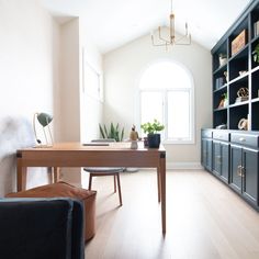 a living room filled with furniture and a wooden table