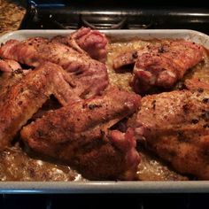 some meat is sitting in a pan on the stove