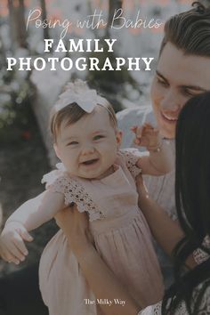 a woman holding a baby in her arms