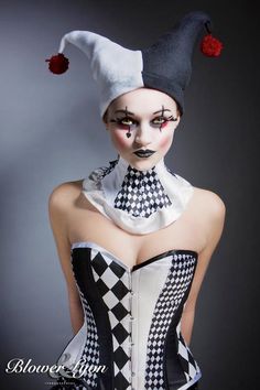 a woman with makeup on her face is dressed in a corset and hat