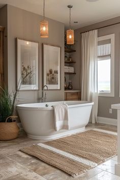 a bathroom with a tub, rug and two lights hanging from the ceiling above it