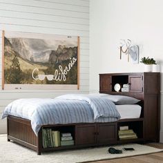 a bed with a book shelf underneath it