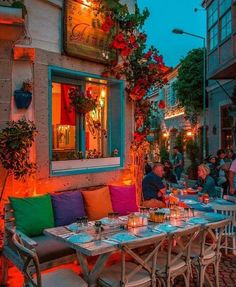 an outdoor dining area with tables and chairs