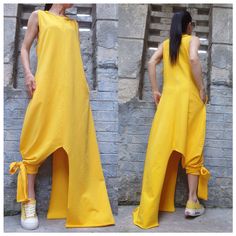 "Casual summer sleeveless yellow dress with side pocket . The asymmetrical length on one side is long to the ankle and on the other side is tied to the leg🤩 Extravagant designs and high quality fabrics. The item from the pictures is size S For more information feel free to ask questions. Material &Care Cotton and elastane Machine wash 30oC Hand wash at low temperatures Do not machine dry Medium hot iron Sizing We make sizes from xs to 5xl as well as customized measures.So don't hesitate to cont Spring Sleeveless Asymmetrical Dress With Side Slits, Sleeveless Asymmetrical Dress With Side Slits, Yellow Asymmetrical Maxi Dress For Summer, Yellow Sleeveless Asymmetrical Dress For Spring, Summer Maxi Dress With Side Slits And Asymmetrical Hem, Fitted Yellow Asymmetrical Summer Dress, Yellow Fitted Asymmetrical Summer Dress, Yellow Asymmetrical Summer Dress, Fitted Yellow Asymmetrical Sleeveless Dress