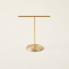 a brass table with a white background