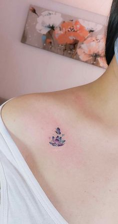 a woman with a small tattoo on her shoulder