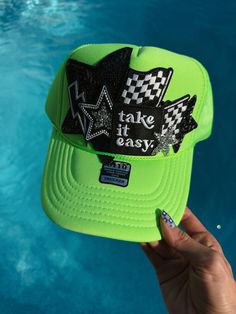 Neon green Women's trucker hat that says, "Take it Easy." checkered flag and lots of blingy star patches. Makes the perfect hair accessory and gift! Star Patches, Trucker Hat Black, Women Trucker, Checkered Flag, Take It Easy, Perfect Hair, Neon Green, Hair Accessory