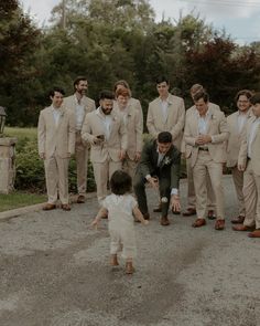 Tan Suit Ring Bearer, Tan Suit Groomsmen Green Bridesmaid, Tan Linen Wedding Suit, Groomsmen Tan Suit Green Tie, Earth Tone Groomsmen Attire, Sand Colored Groomsmen, Tan Linen Groomsmen Suits, Tan Suit No Tie Wedding, Beige And Green Groomsmen Suits