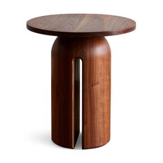 a small wooden table with two legs and a round top on the side, against a white background