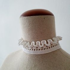 This white Neck Ruff crochet choker necklace is made from 100% high-quality mercerized white cotton and tied with a white pearl button.  Choker length 35 cm / 13,8 inches, width - 3 cm / 1,2 inches. A simple yet elegant accessory that will work well with a lot of looks. The choker is similar to the Elizabethan ruffled lace collar. Teenagers, who prefer clothes in the Gothic style, also like to wear them to emphasize their individuality. The choker can be used as an additional accent for creating costumes for Cosplay. When ordering, you can make a note of a custom neckline length if you would like. It can be made also in different colours, but keep in mind that this might push the date when the item is shipped out back by a few days. The colour in the picture might not be accurate due to di Handmade White Necklaces For Spring, White Adjustable Choker Necklace, Elegant Handmade Summer Choker, Adjustable Lace Trim Choker, Elegant White Choker For Summer, Elegant White Summer Choker, Handmade White Choker For Spring, White Lace Choker Gift, Spring White Adjustable Choker