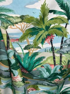 a tropical print fabric with palm trees on it