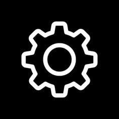 the gear icon is shown in white on a black background, it appears to be an image