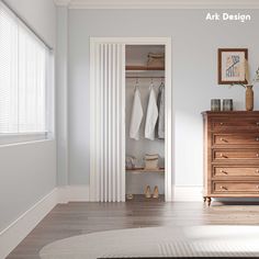 an open closet with clothes hanging on the door and shoes sitting on the floor next to it