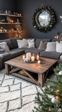 a living room filled with lots of furniture and christmas lights on the table in front of it