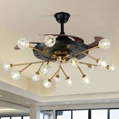 a ceiling fan with many lights in a room