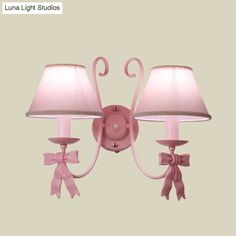 This elegant wall light from our collection provides an elegant and charming touch to any room. The cute Macaron Pink Finish Bow Wall Lamp with Conic Fabric Shade features two lights – with one light on either side, this wall light helps to create a warm and inviting atmosphere making it ideal for any bedroom. The size of the wall light is 15 to 19 Inch 5 to 9 Inch, and it is perfect for bedrooms with a smaller space. It also comes with a voltage of 220V-240V 110V-120V.The lamp is made of durabl Bow Wall, Wall Lamp Design, Corner Wall, Metal Hanging Lights, Semi Flush Mount Lighting, Outdoor Wall Lamps, Wall Mounted Light, Bedroom Lighting, Outdoor Lamp