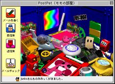 the computer screen shows an image of various objects and colors, including a rainbow in the background