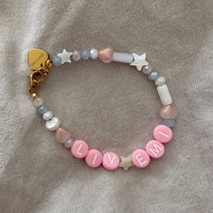 Materials Pink letter beads Freshwater pearl beads Acrylic beads Gold plated stainless steel Please leave name in notes at check out Each bracelet may vary and are not identical as they are custom made. Name Bead Bracelet, Pink Letter, Letter Beads, Acrylic Beads, Accessories Branding, Bracelet Patterns, Bead Bracelet, Bracelet Sizes, Pearl Beads