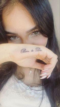 a woman holding her hand up to her face with the words love and life written on it