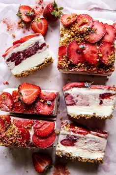 four slices of cake with strawberries on top