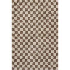 a brown and white rug with squares on it