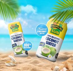 two cans of tropical sun coconut water on the beach with shells and palm trees in the background