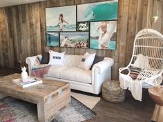 a living room filled with furniture and pictures on the wall