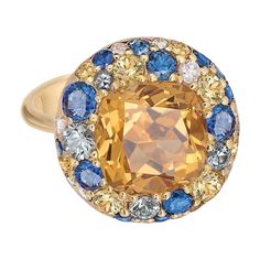 Ring Yellow 18 K Gold (Matching Earrings Available) Weight 7.7 gramm Diamond 1-Round-0.05ct-3 / 5A Diamond 7-Round-0,12ct-3 / 5A Citrine 1- Square-4.48ct 2 / 1A Yellow sapphire- 9-0.6ct Sapphire syn 12-Circle-1.08ct T (3) / 2A With a heritage of ancient fine Swiss jewelry traditions, NATKINA is a Geneva based jewellery brand, which creates modern jewellery masterpieces suitable for every day life. It is our honour to create fine jewelry, and it’s for that reason that we choose to only work with high-quality, enduring materials that can almost immediately turn into family heirlooms. From our selection of precious metals set with genuine precious stones, you can rest assured that NATKINA is jewelry for your everyday life, forever. Topaz Yellow, Modern Jewellery, Diamond Rings Design, Citrine Jewelry, Cushion Cut Ring, Jewellery Brand, Diamond Cocktail Rings, Modern Ring, Diamond Gold