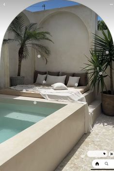 an indoor pool with a couch and potted palm tree in the background, viewed through a fish eye lens