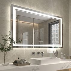 a bathroom with a large mirror above the sink