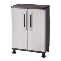 a white and black cabinet with two doors