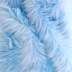 blue and white fur textured up close to the camera, as if it were real or fake