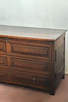 an old wooden dresser sitting on the floor