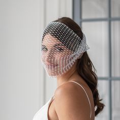 a woman wearing a veil over her head