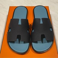 Nib Hermes Izmir Sandals Size 41 Marine Blue Modern Blue Slip-on Sandals, Blue Slip-on Modern Sandals, Blue Modern Slip-on Sandals, Blue Open Toe Slides With Rubber Sole, Blue Leather Sole Sandals For The Beach, Blue Sandals With Leather Sole For Beach, Blue Leather Slides For Summer, Blue Beach Sandals With Leather Sole, Blue Leather Slide Sandals