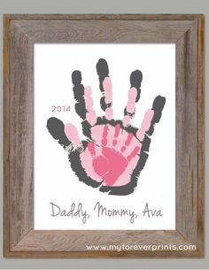 a handprint is displayed in a frame with the word daddy's mommy - ava on it