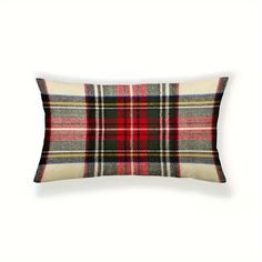 a plaid pillow on a white background