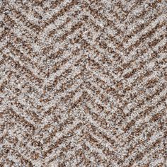 an up close view of a carpet with brown and white colors