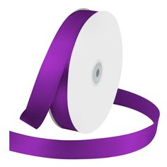 a roll of purple satin ribbon with a white center on the side and one end