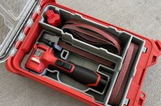 a red tool box with tools in it