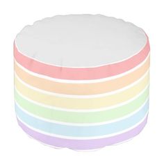 a multicolored round poufle on a white background, with the colors of rainbow