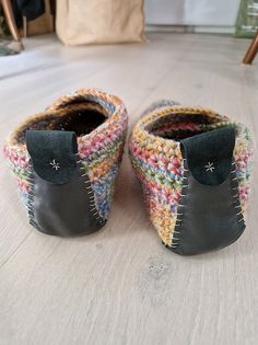 A pair of easy crochet shoes with leather soles.