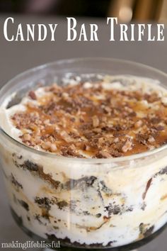 an image of a dessert in a glass bowl with the words candy bar trifle on it