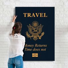 a woman standing in front of a wall with a blue and gold travel sign on it