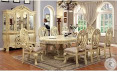 a dining room table with chairs and a chandelier